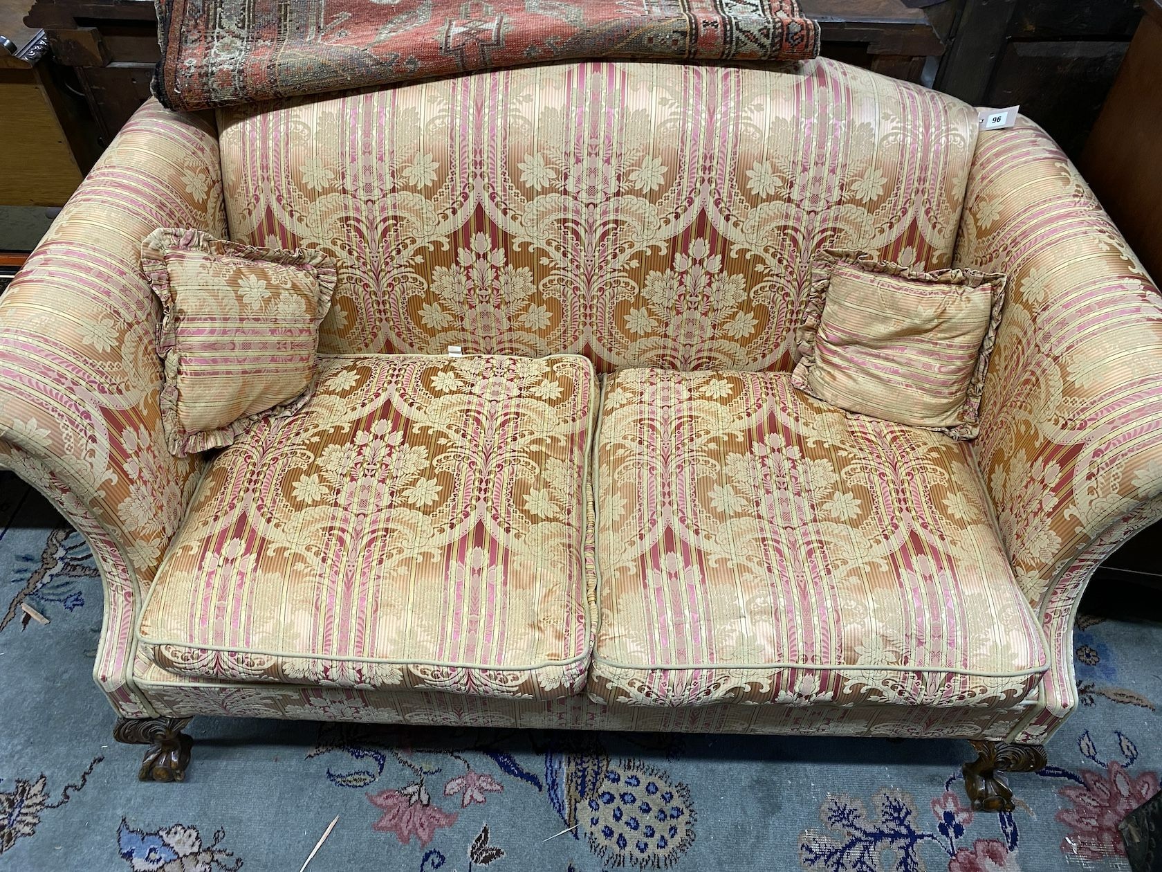 A George III style upholstered mahogany hump back two seater settee, length 156cm, depth 90cm, height 92cm